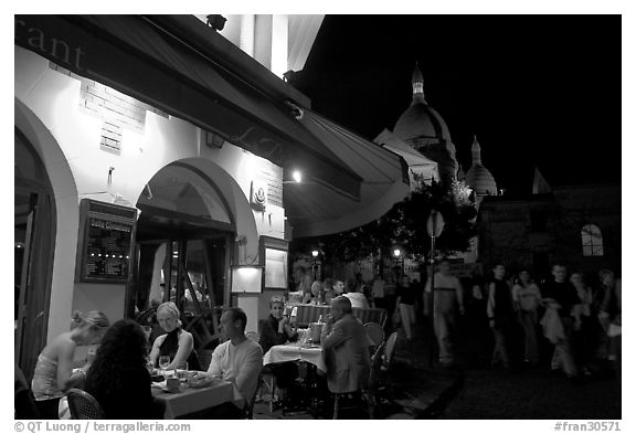 Outdoor restaurant at night on the Place du Tertre, Montmartre. Paris, France