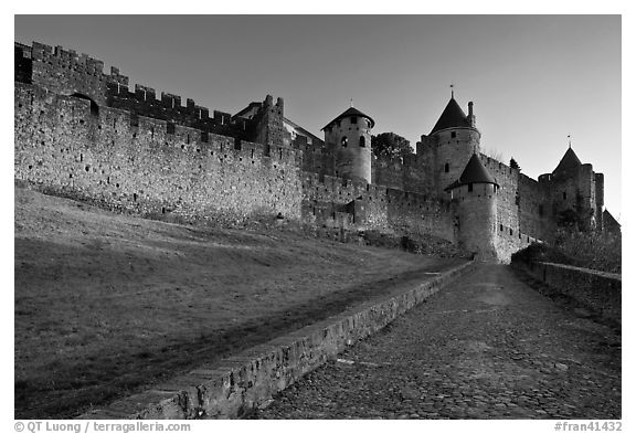 Path leading to old walled city. Carcassonne, France (black and white)