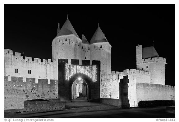 Medieval city and main entrance by night. Carcassonne, France (black and white)