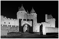 Medieval city and main entrance by night. Carcassonne, France (black and white)