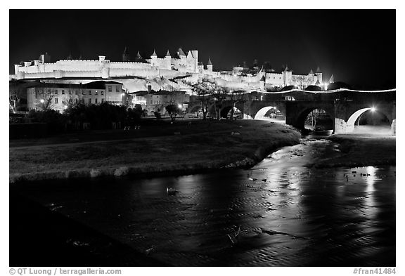 Fortified city and Pont Vieux crossing the Aude River by night. Carcassonne, France