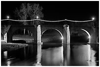 Pont Vieux illuminated by night with Christmas lights. Carcassonne, France (black and white)