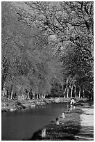 Walkway and boat along Canal du Midi. Carcassonne, France ( black and white)