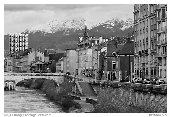 Isere riverbank and snowy mountains. Grenoble, France (black and white)