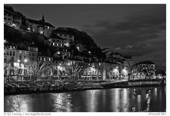 Night view with Isere River and illuminations reflected. Grenoble, France (black and white)