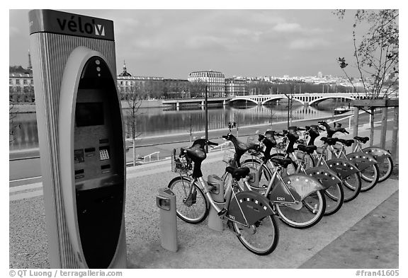 Bicycles for rent with automated kiosk checkout. Lyon, France (black and white)