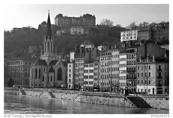 Saint George church and houses on the banks of the Saone River. Lyon, France (black and white)