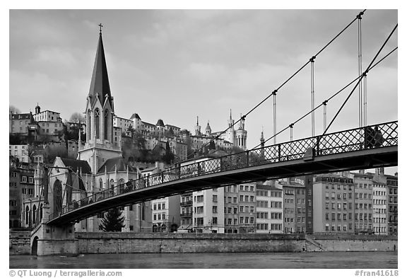Suspension brige on the Saone River and St-George church. Lyon, France (black and white)