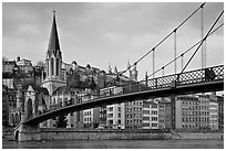 Suspension brige on the Saone River and St-George church. Lyon, France (black and white)