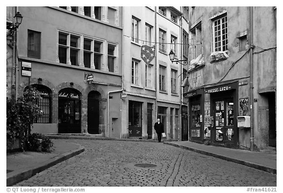 Small square in old city with coblestone pavement. Lyon, France (black and white)