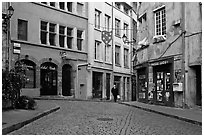 Small square in old city with coblestone pavement. Lyon, France (black and white)