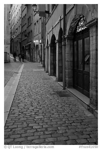 Cobblestone pavement on historic distric street. Lyon, France (black and white)