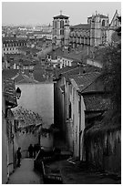 Stairs, rooftops, St-Jean Cathedral, and Ferris Wheel at dusk. Lyon, France ( black and white)