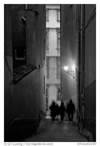 Silhouettes in staircase on Fourviere Hill at dusk. Lyon, France (black and white)