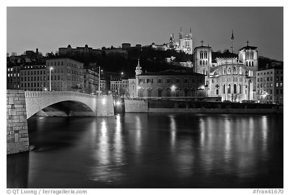 Napoleon Bridge, Saone River and Fourviere Hill at night. Lyon, France