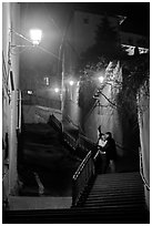 Couple embrassing romantically on stairs to Fourviere Hill. Lyon, France ( black and white)