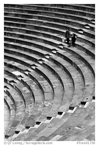 Couple standing in amphitheater, Orange. Provence, France