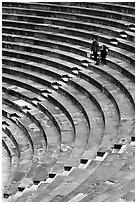 Couple standing in amphitheater, Orange. Provence, France (black and white)