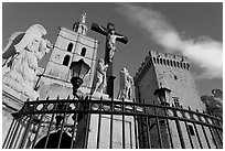 Crucifix in front of Notre-Dame-des-Doms Cathedral. Avignon, Provence, France (black and white)