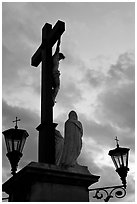 Cross with Christ at sunset. Avignon, Provence, France ( black and white)
