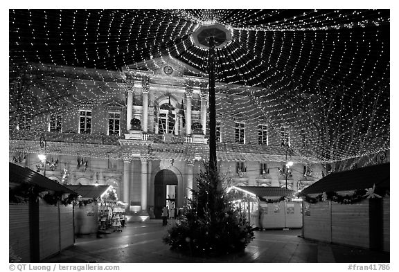 Christmas fair and City hall at night. Avignon, Provence, France