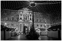 Christmas fair and City hall at night. Avignon, Provence, France (black and white)