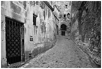 Narrow street, Les Baux-de-Provence. Provence, France (black and white)