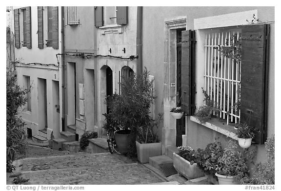 Facades of painted houses. Arles, Provence, France (black and white)