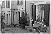 Facades of painted houses. Arles, Provence, France ( black and white)