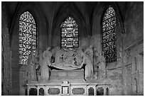 Christ sculpture and stained glass windows, St Trophime church. Arles, Provence, France ( black and white)