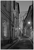 Narrow street at night. Arles, Provence, France (black and white)