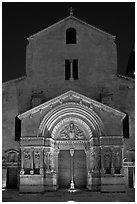 Facade of the Saint Trophimus church at night. Arles, Provence, France (black and white)