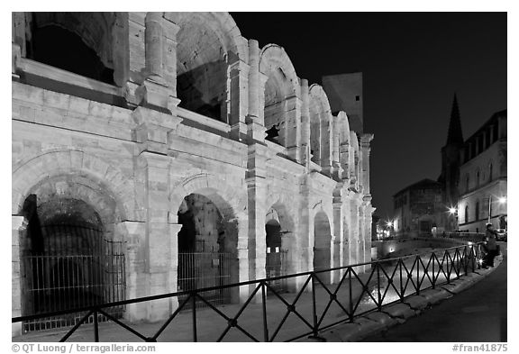 Arenes and church at night. Arles, Provence, France