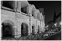 Arenes and church at night. Arles, Provence, France (black and white)