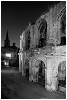 Roman arenes and church at night. Arles, Provence, France ( black and white)