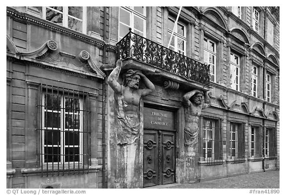 Facade with sculptures supporting a balcony. Aix-en-Provence, France