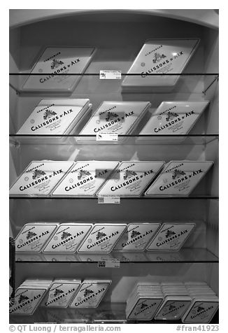 Calisson d'Aix boxes on shelves. Aix-en-Provence, France (black and white)