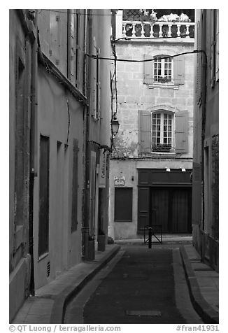 Narrow street in old town. Arles, Provence, France (black and white)