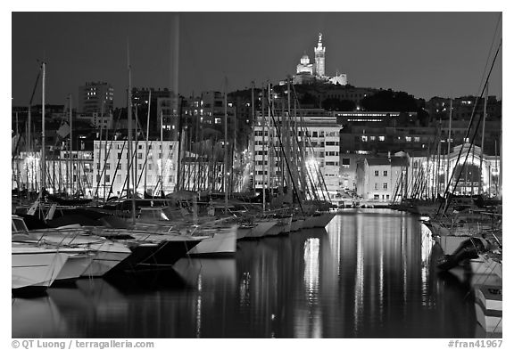 Harbor and Notre Dame de la Garde Basilic on hill. Marseille, France (black and white)