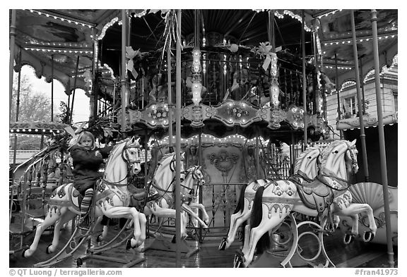 Girl on merry-go-round. Avignon, Provence, France (black and white)