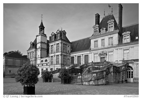 Horseshoe-shaped staircase, main courtyard, Fontainebleau Palace. France (black and white)