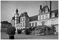 Horseshoe-shaped staircase, main courtyard, Fontainebleau Palace. France (black and white)