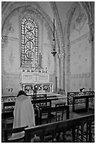 Monks praying in chapel, Saint Quiriace Collegiate Church, Provins. France (black and white)