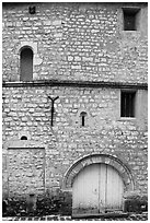 Facade detail of medieval house with small windows, Provins. France ( black and white)