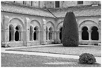 Cloister courtyard with dusting of snow Abbaye de Fontenay. Burgundy, France (black and white)