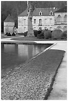 Pond and Abbot's lodging, Fontenay Abbey. Burgundy, France (black and white)