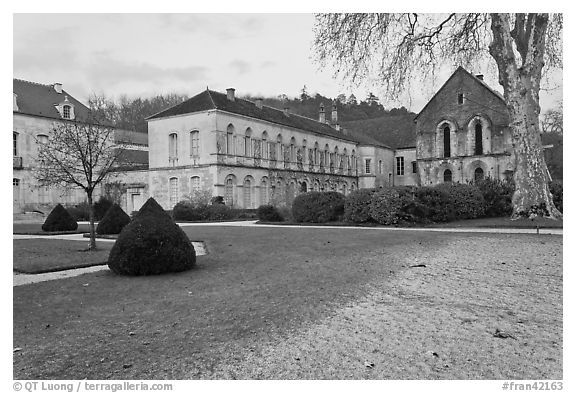 Lawn and forge in winter, Abbaye de Fontenay. Burgundy, France