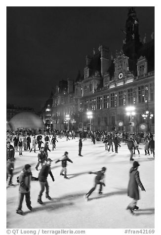Holiday ice ring, City Hall by night. Paris, France
