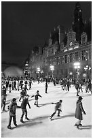 Holiday ice ring, City Hall by night. Paris, France (black and white)