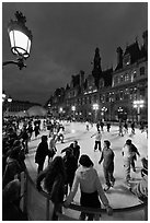 Holiday skating rink at night, City Hall. Paris, France (black and white)